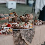 Grazing table prepared for an outdoor wedding catering event